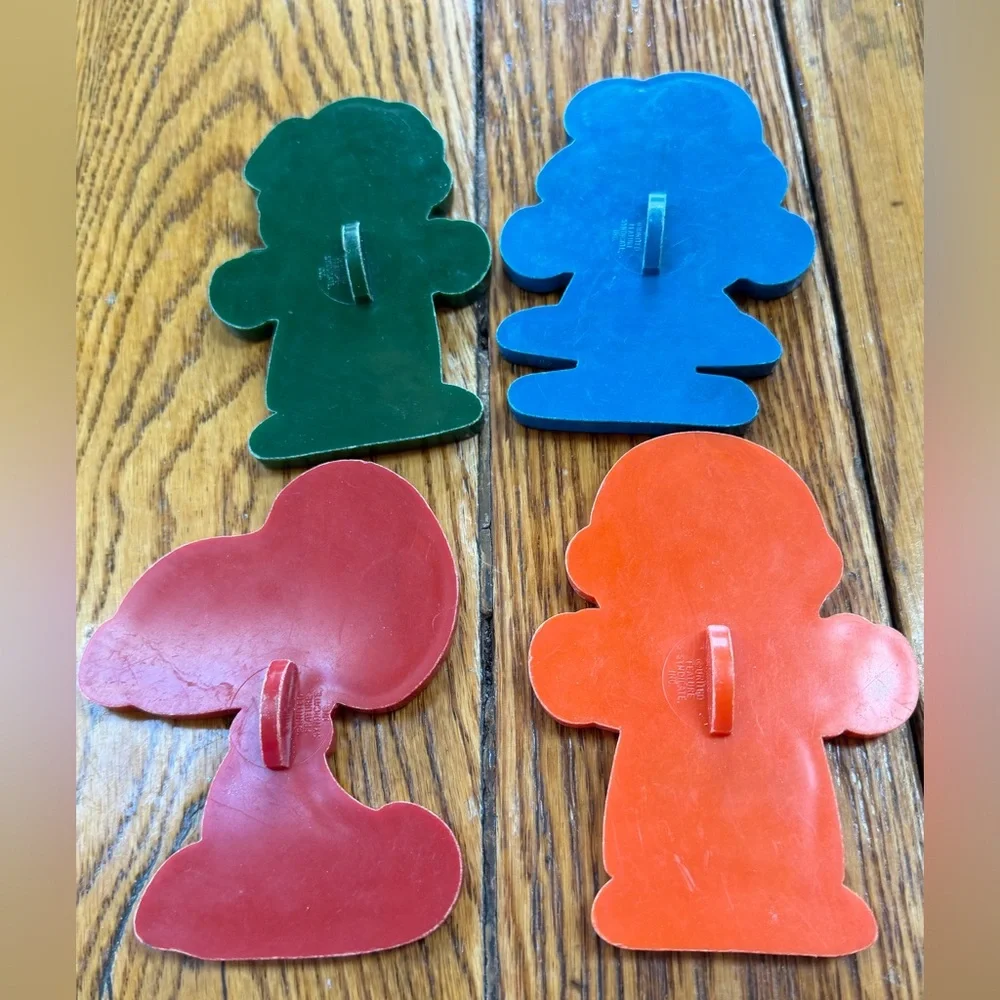 Charlie Brown Peanuts plastic cookie cutters.  Good condition. Set of four.